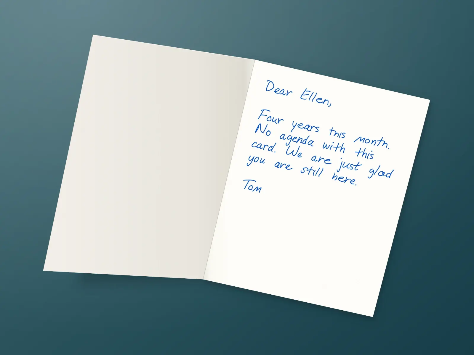 The inside of a handwritten card reading: Dear Ellen, Four years this month. No agenda with this card. We are just glad you are still here. Tom