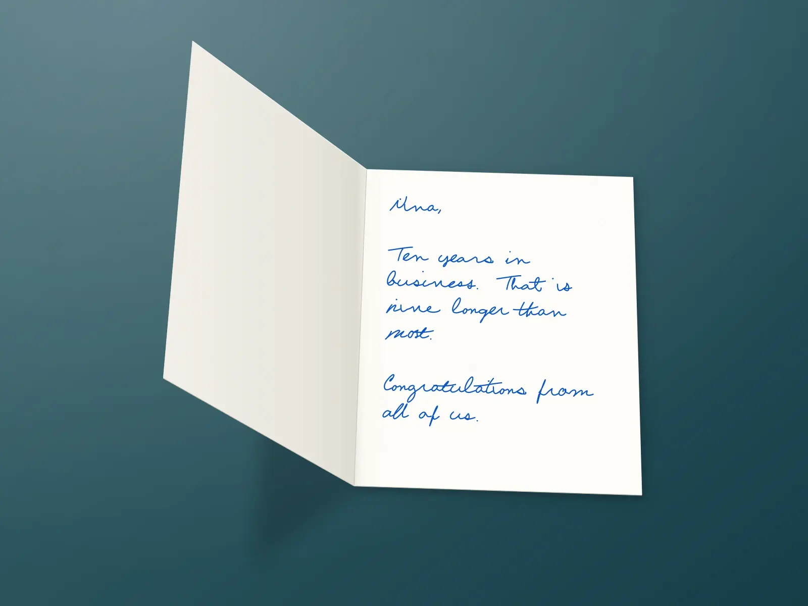 The inside of a handwritten card reading: Nina, Ten years in business. That is nine longer than most. Congratulations from all of us.
