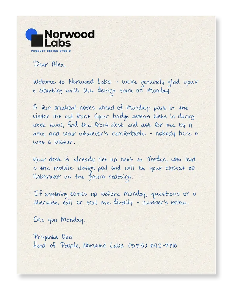A real handwritten onboarding letter welcoming a new hire, penned in blue ink on company letterhead