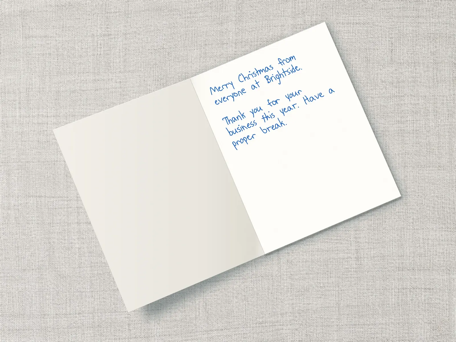 The inside of a handwritten card reading: Merry Christmas from everyone at Brightside. Thank you for your business this year. Have a proper break.