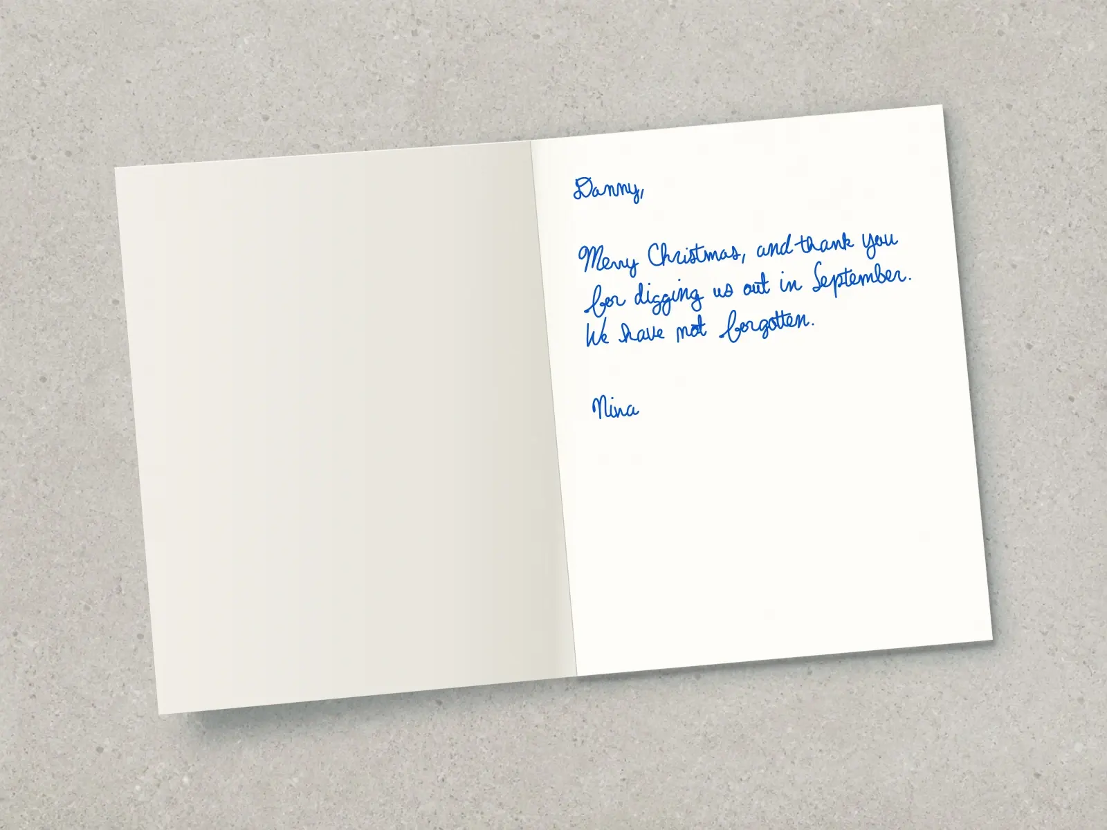 The inside of a handwritten card reading: Danny, Merry Christmas, and thank you for digging us out in September. We have not forgotten. Nina