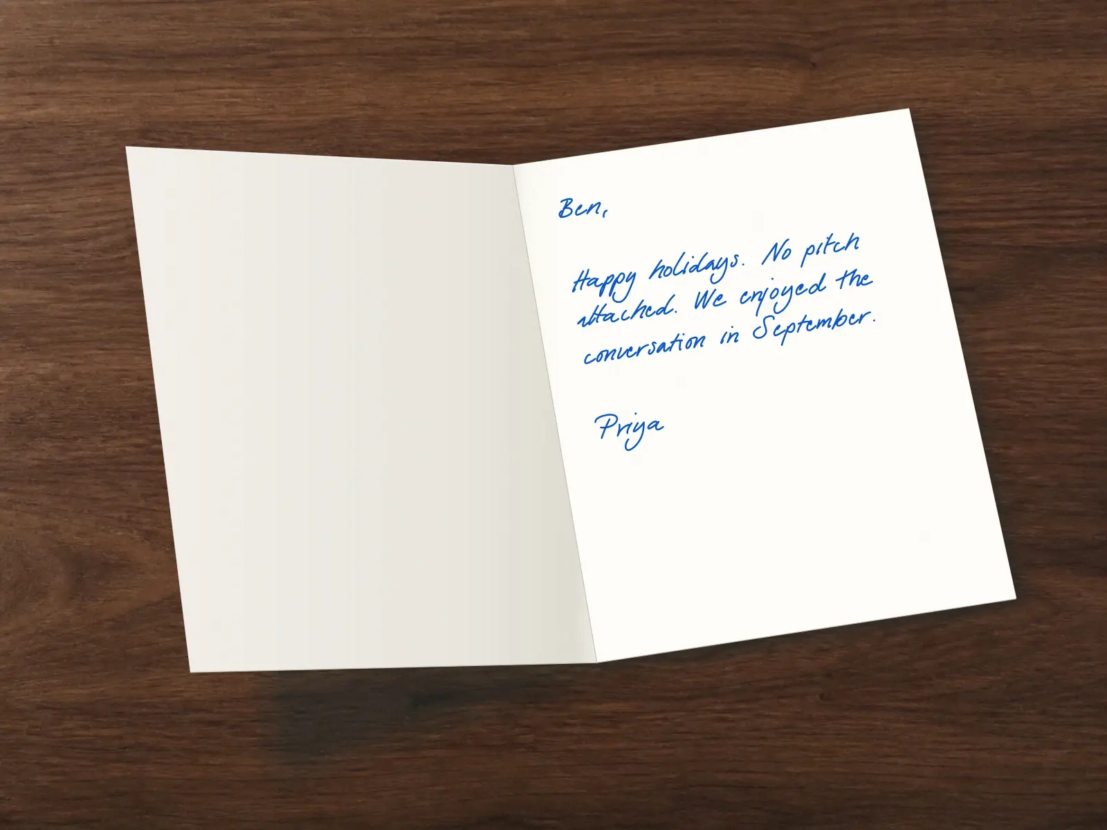 The inside of a handwritten card reading: Ben, Happy holidays. No pitch attached. We enjoyed the conversation in September. Priya