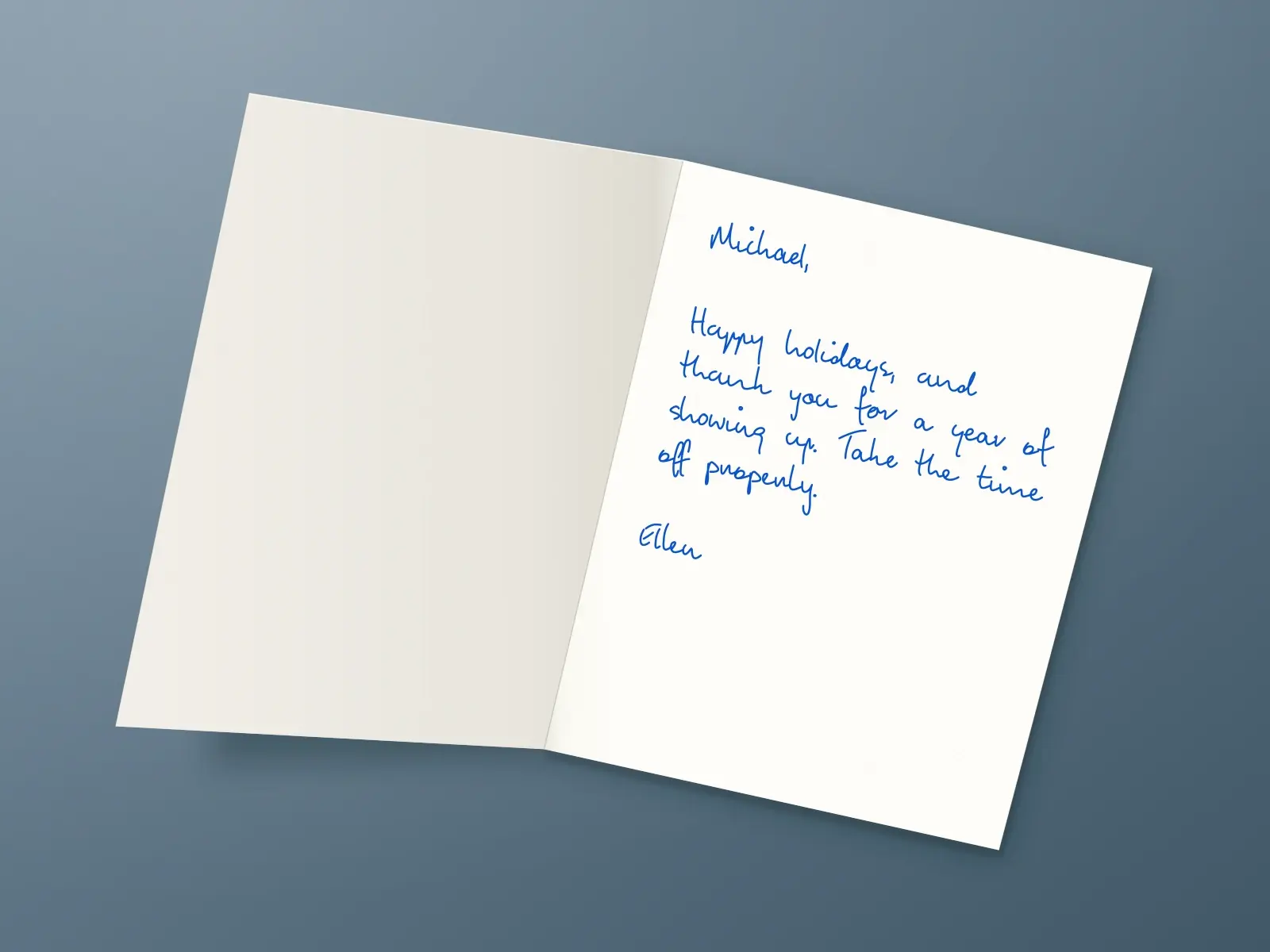The inside of a handwritten card reading: Michael, Happy holidays, and thank you for a year of showing up. Take the time off properly. Ellen