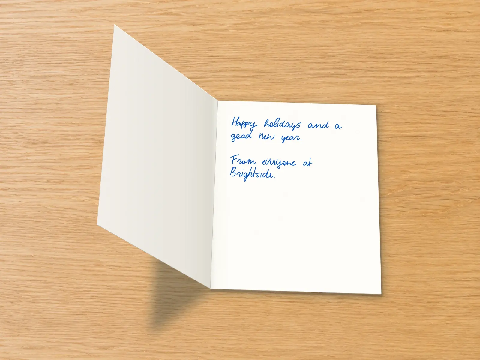 The inside of a handwritten card reading: Happy holidays and a good new year. From everyone at Brightside.
