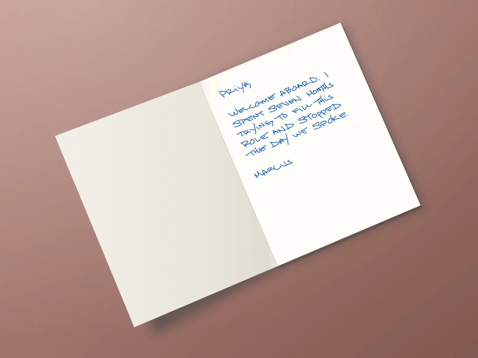The inside of a handwritten card reading: Priya, Welcome aboard. I spent seven months trying to fill this role and stopped the day we spoke. Marcus