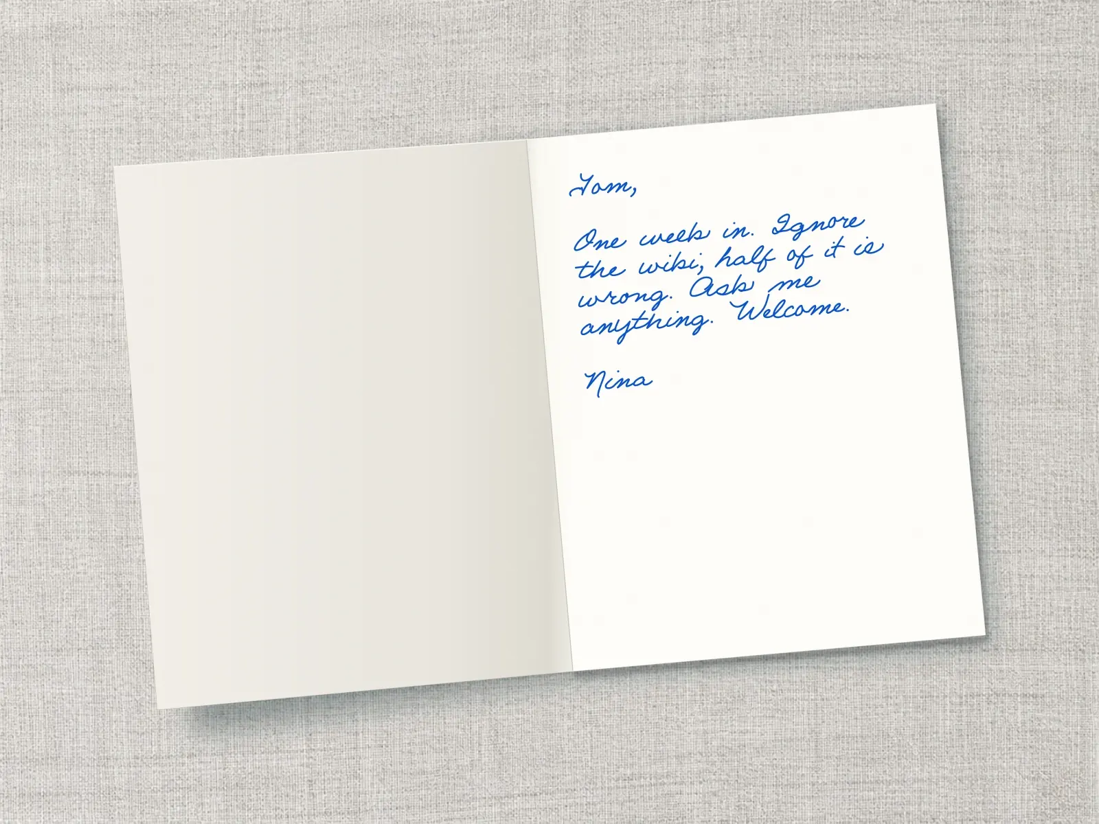 The inside of a handwritten card reading: Tom, One week in. Ignore the wiki, half of it is wrong. Ask me anything. Welcome. Nina