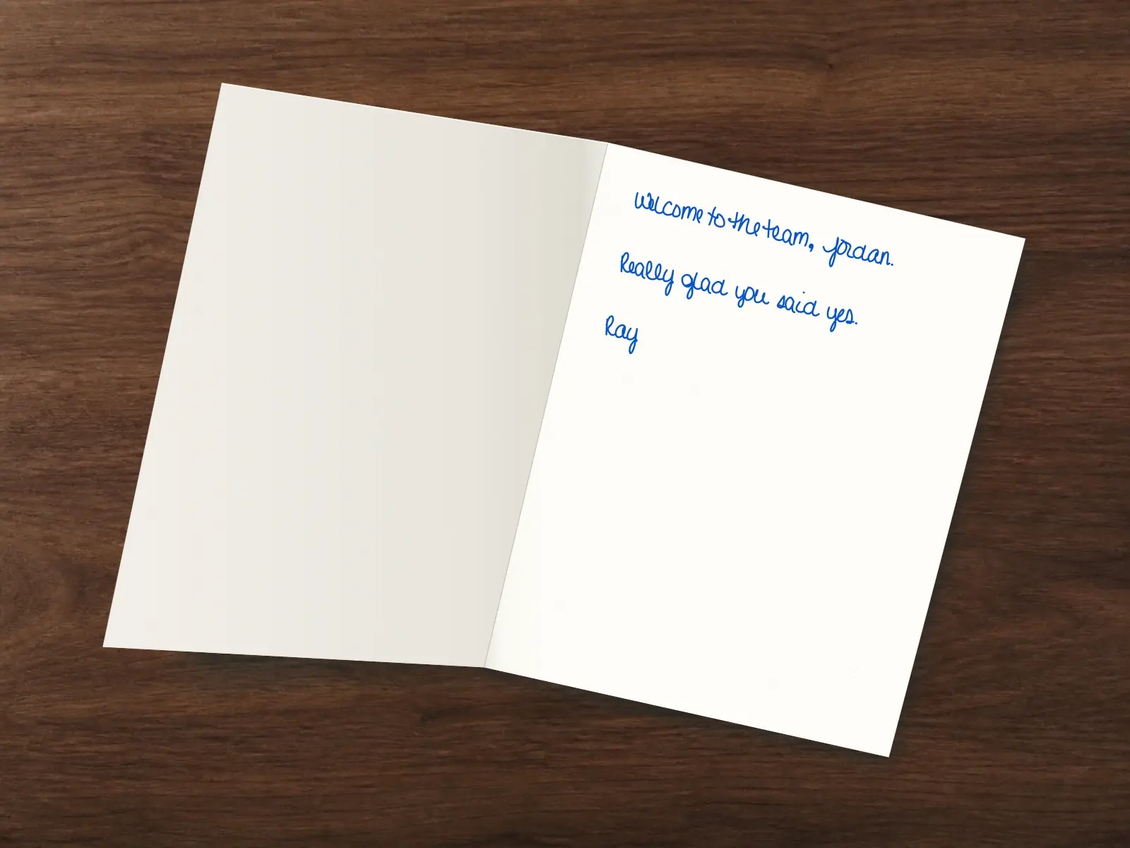 The inside of a handwritten card reading: Welcome to the team, Jordan. Really glad you said yes. Ray