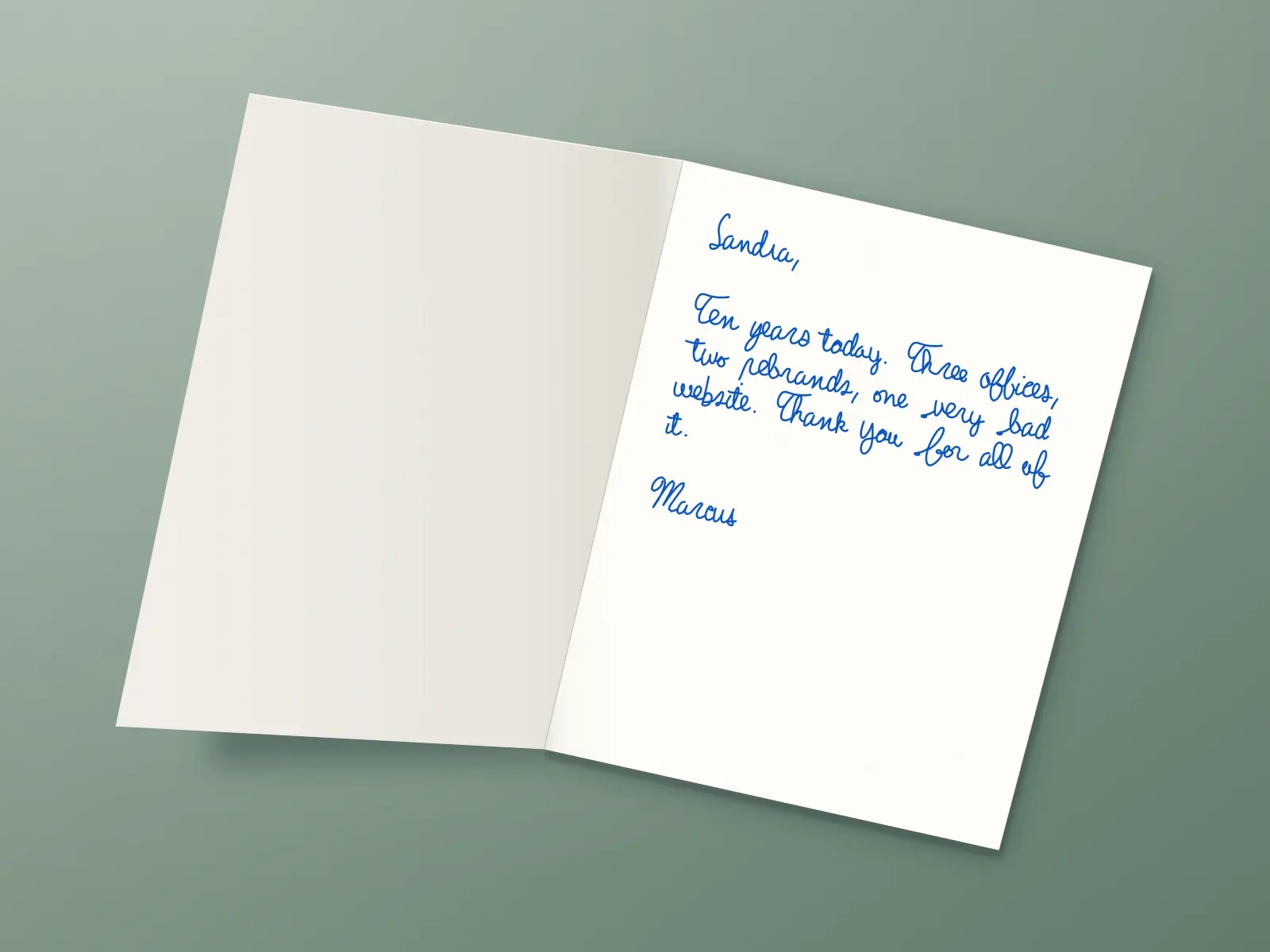 The inside of a handwritten card reading: Sandra, Ten years today. Three offices, two rebrands, one very bad website. Thank you for all of it. Marcus