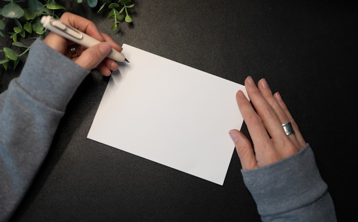 Person Writing a Handwritten Card